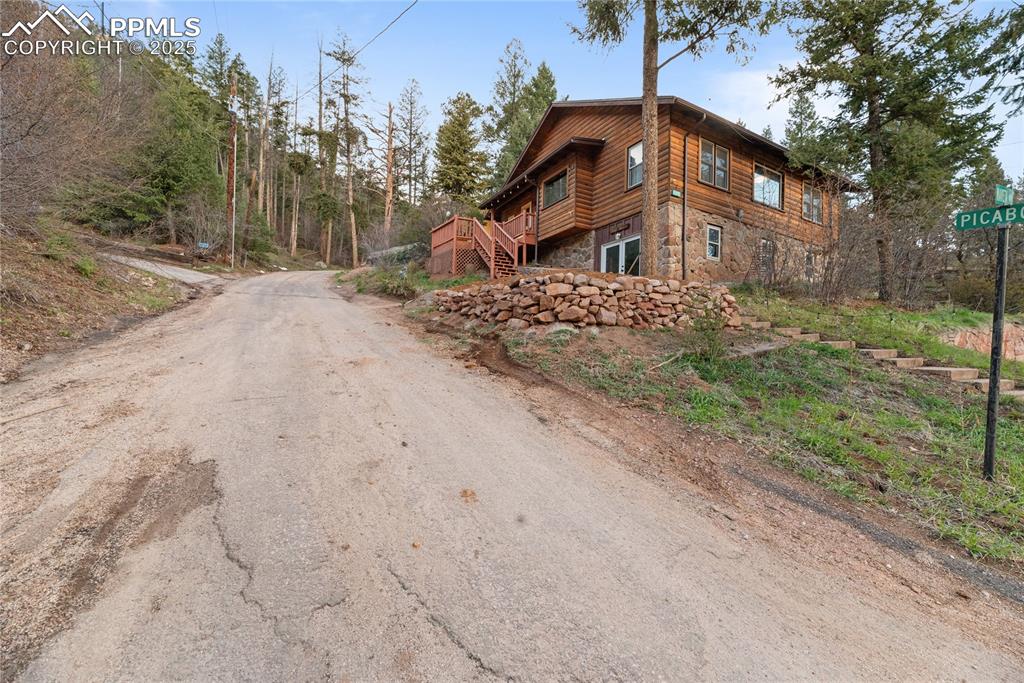 9270 Picabo Road Cascade, CO 80809 - Photo 31 of 31 a front view of a house with a yard