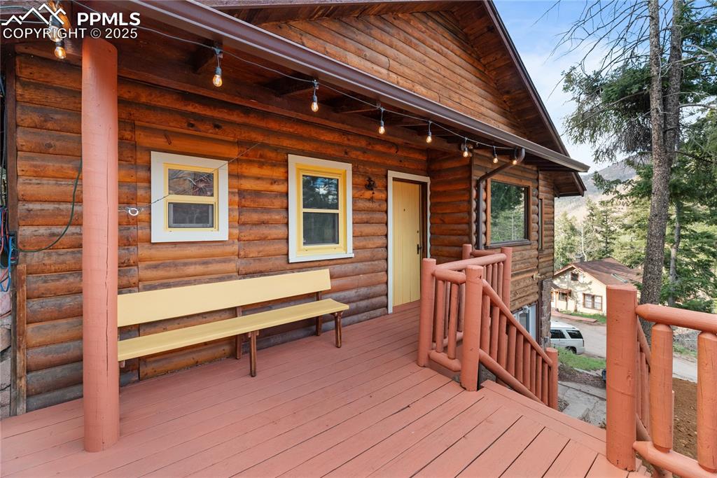 9270 Picabo Road Cascade, CO 80809 - Photo 4 of 31 a view of wooden deck with a barbeque grill and wooden fence