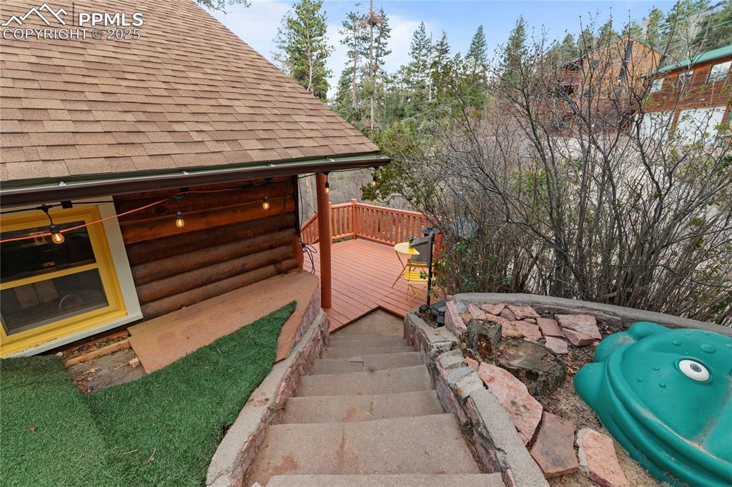 9270 Picabo Road Cascade, CO 80809 - Photo 5 of 31 a view of backyard with a deck and a garden