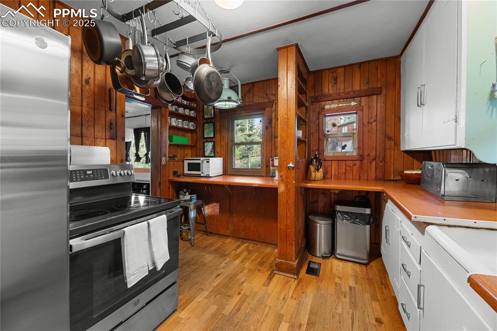 9270 Picabo Road Cascade, CO 80809 - Photo 10 of 31 a kitchen with stainless steel appliances granite countertop a stove and a sink