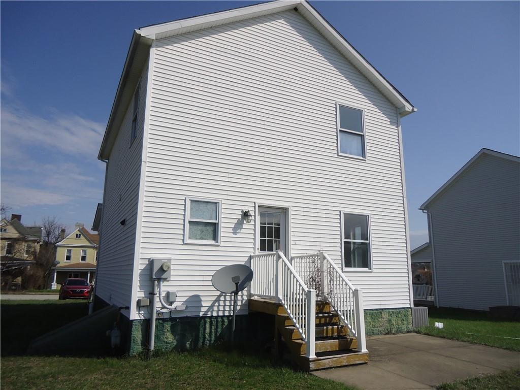608 Reed Avenue Monessen, PA 15062 - Photo 17 of 20 a view of a house with a yard