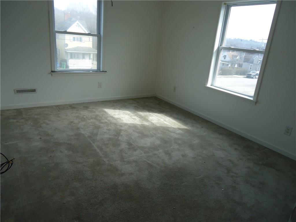 608 Reed Avenue Monessen, PA 15062 - Photo 5 of 20 an empty room with a window