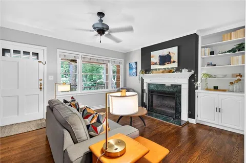 a living room with furniture and a fireplace