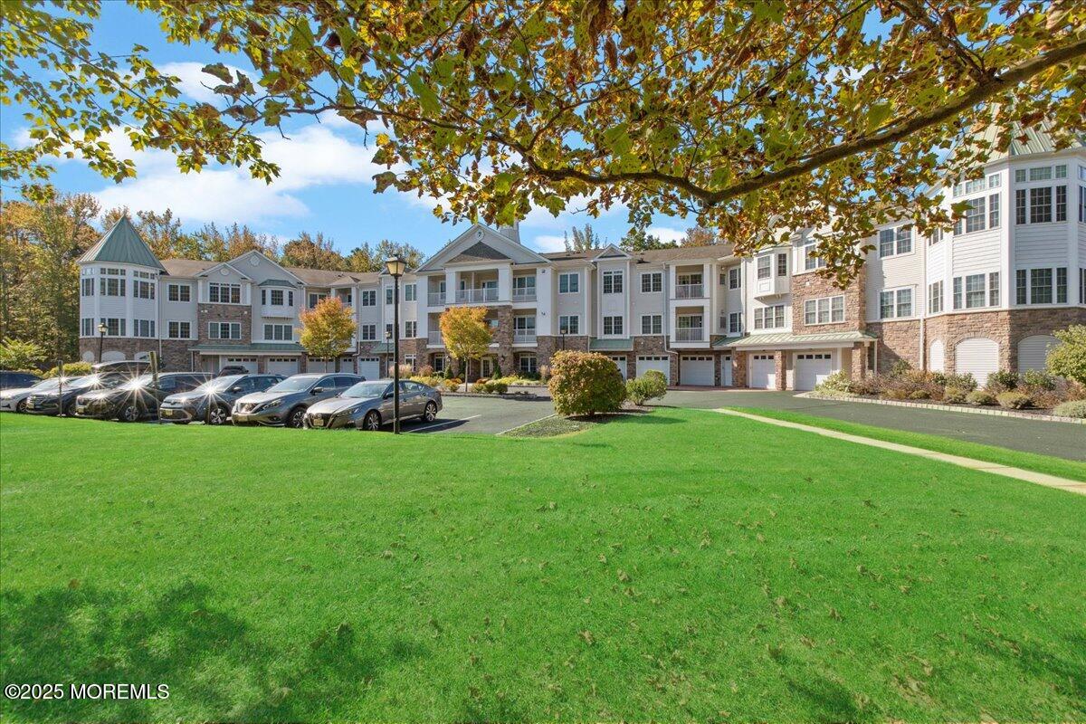 7317 Falston Circle, Unit 7317 Old Bridge, NJ 08857 - Photo 1 of 24 a front view of a building with garden