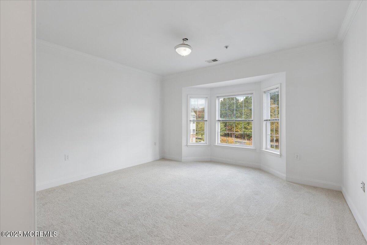 7317 Falston Circle, Unit 7317 Old Bridge, NJ 08857 - Photo 16 of 24 a view of an empty room with a window