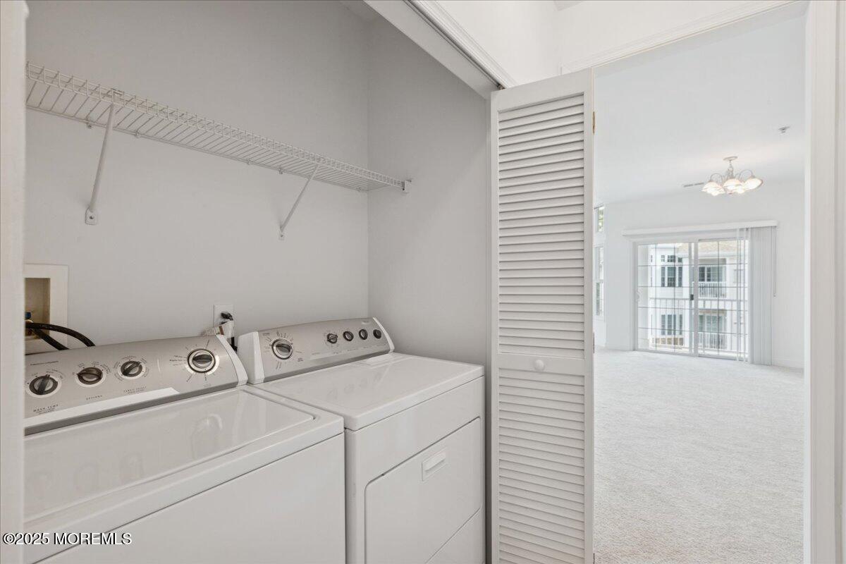 7317 Falston Circle, Unit 7317 Old Bridge, NJ 08857 - Photo 21 of 24 a utility room with dryer and washer
