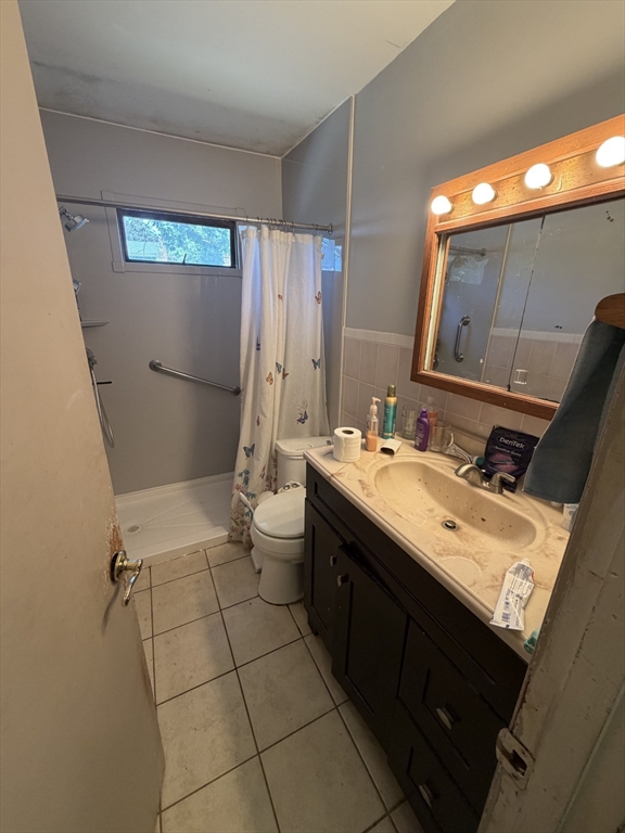 42 Birch Road Westford, MA 01886 - Photo 6 of 10 a bathroom with a double vanity sink mirror and toilet