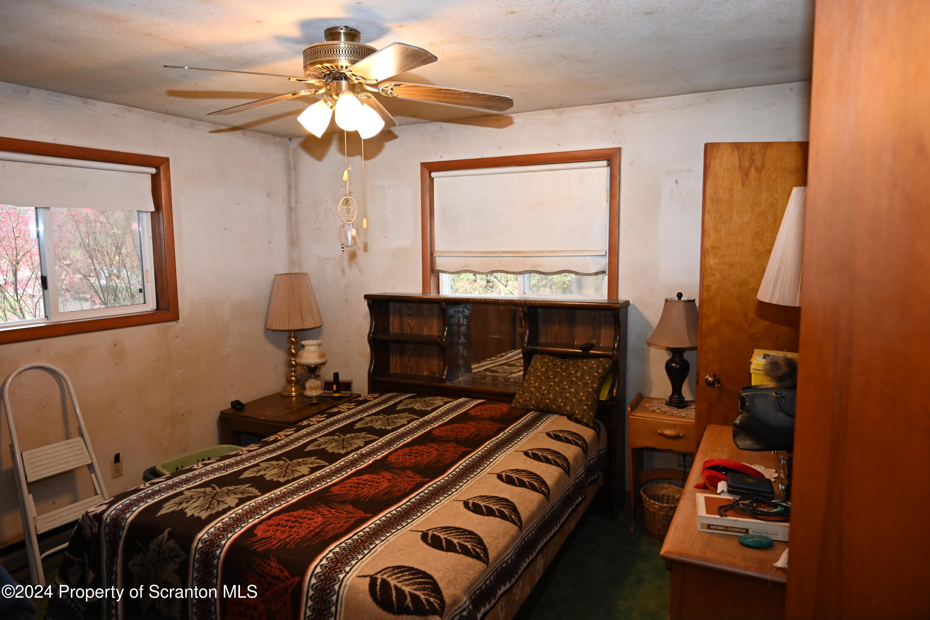 35 Pine Ayre Road Hallstead, PA 18822 - Photo 13 of 24 a bedroom with a bed and a chandelier