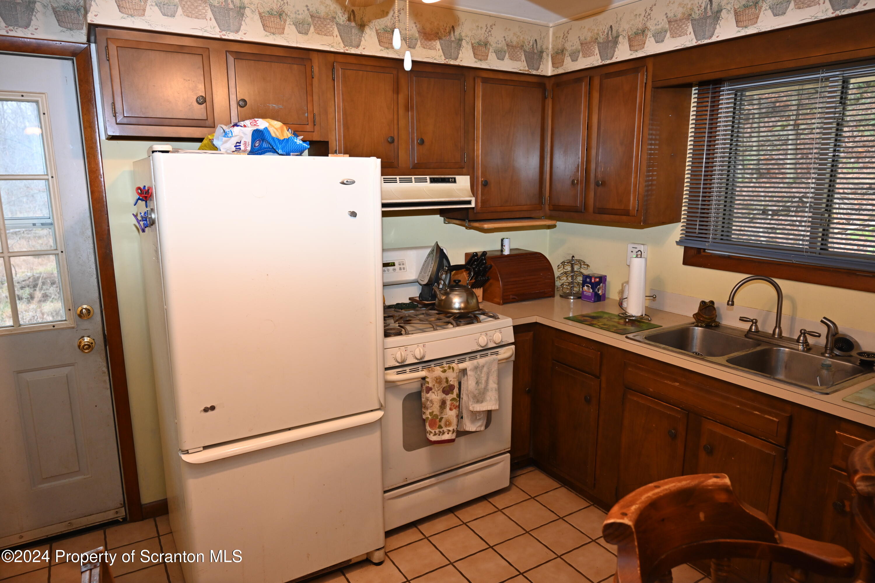 35 Pine Ayre Road Hallstead, PA 18822 - Photo 3 of 24 a kitchen with a sink a refrigerator and cabinets