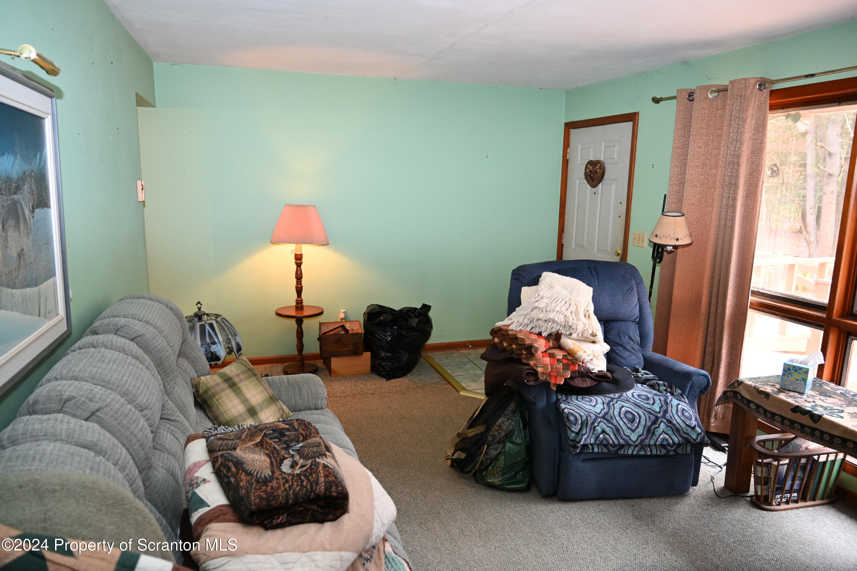 35 Pine Ayre Road Hallstead, PA 18822 - Photo 8 of 24 a living room with furniture toys and a window