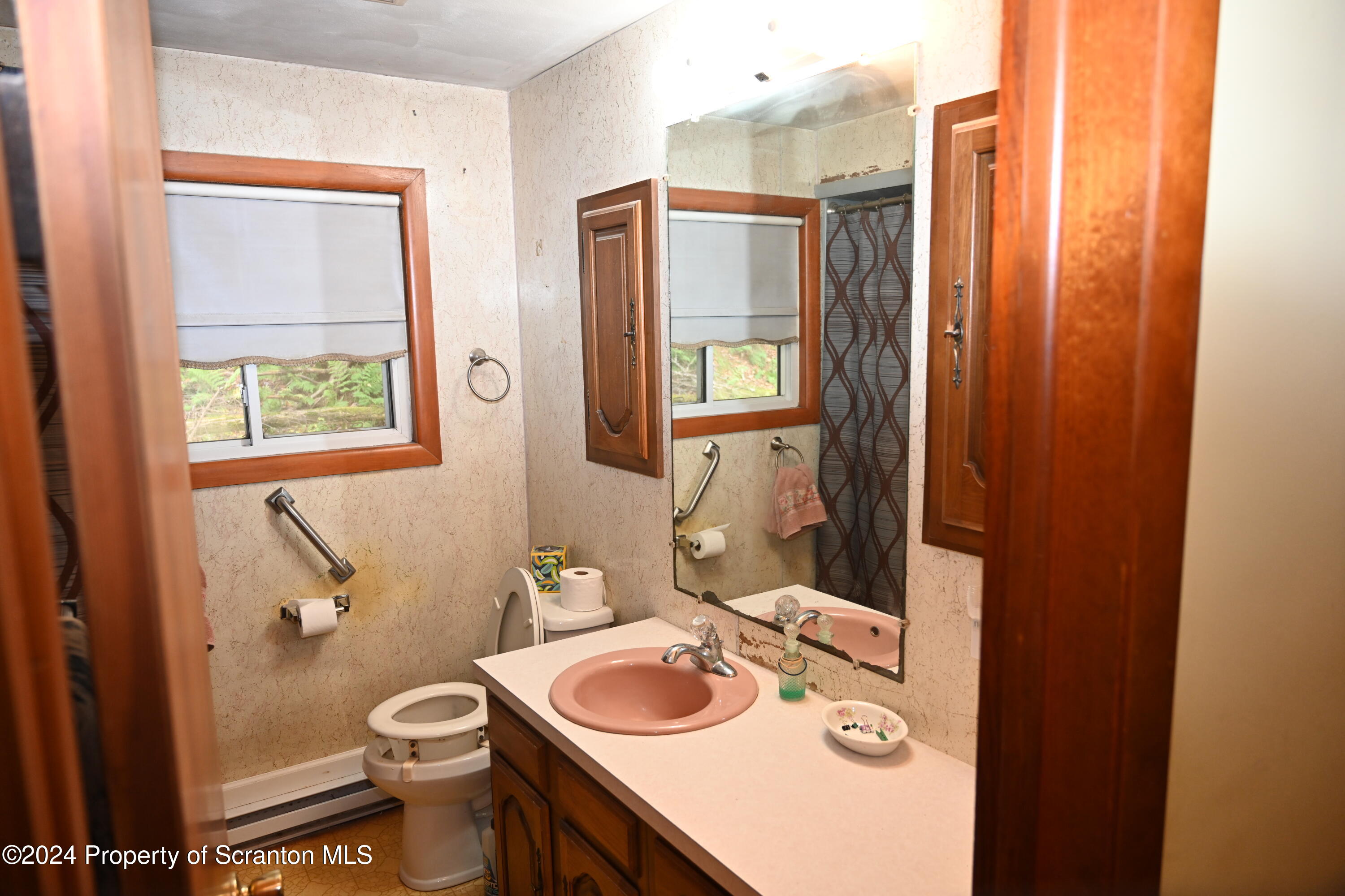 35 Pine Ayre Road Hallstead, PA 18822 - Photo 9 of 24 a bathroom with a toilet sink vanity granite and mirror