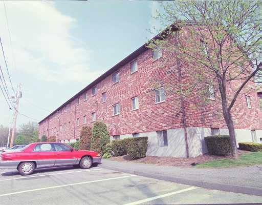 34 Westgate Road, Unit 2 34 Boston, MA 02467 - Photo 1 of 1 a front view of a house with parking space