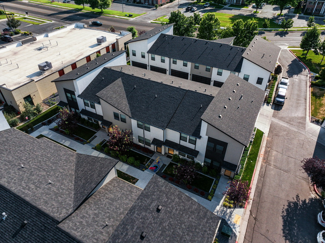 220 Spring Creek Parkway Providence, UT 84332 - Photo 16 of 26 Modern townhome community featuring contemporary architectural design with white and dark gray facades