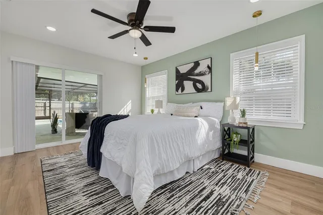 a bedroom with a large bed and a window