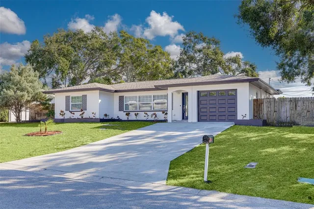a view of a house with a yard