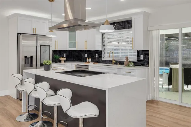 a kitchen with a sink cabinets and window