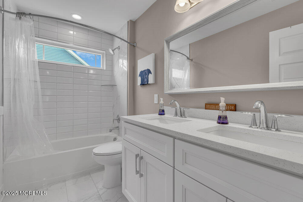 25 Seaton Road Toms River, NJ 08755 - Photo 30 of 52 a bathroom with a granite countertop sink a toilet and shower
