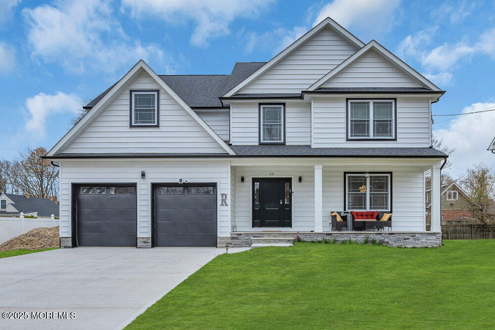 25 Seaton Road Toms River, NJ 08755 - Photo 3 of 52 a front view of a house with a yard and garage
