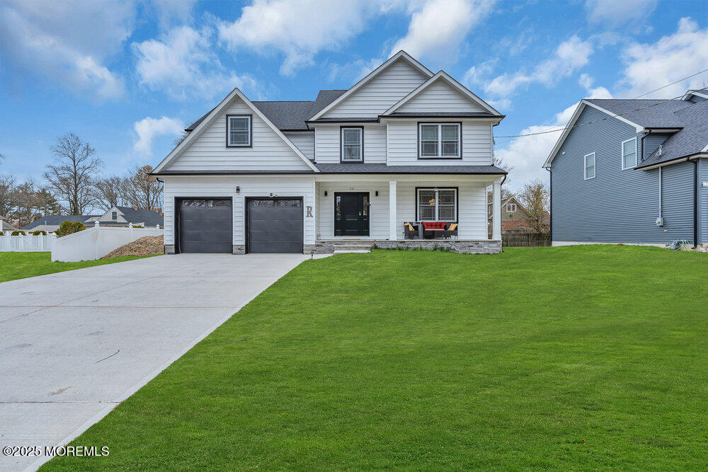 25 Seaton Road Toms River, NJ 08755 - Photo 6 of 52 a front view of a house with a yard and garage
