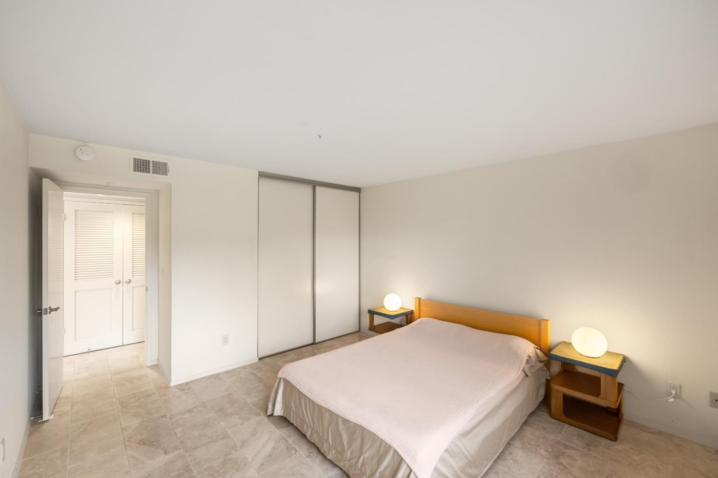 121 Quail Run Court Del Rey Oaks, CA 93940 - Photo 17 of 33 a bedroom with a bed and dresser