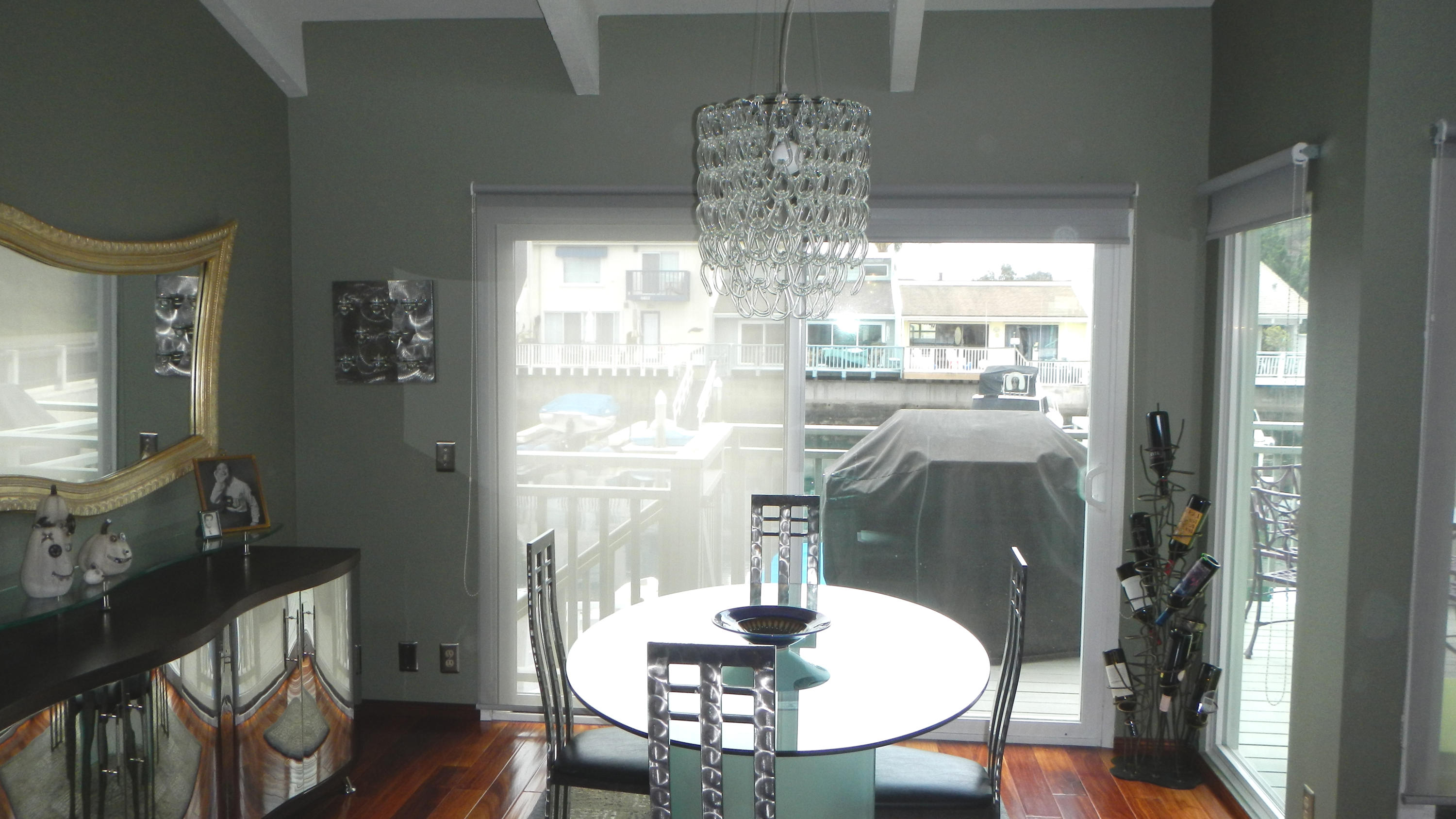 4640 Eastbourne Oxnard, CA 93035 - Photo 15 of 49 a dining room with furniture a chandelier and wooden floor
