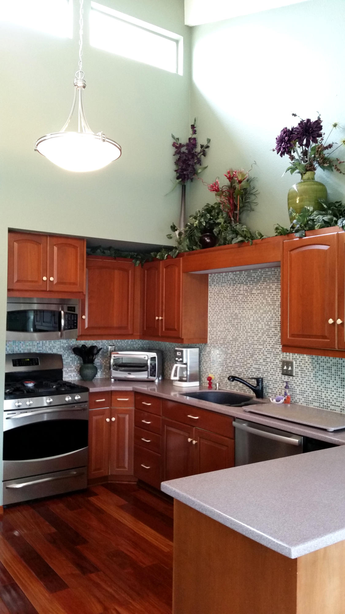 4640 Eastbourne Oxnard, CA 93035 - Photo 16 of 49 a kitchen with a sink and cabinets