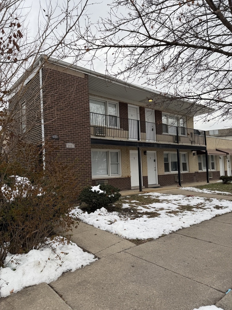 5331 South Kilbourn Avenue, Unit 6 Chicago, IL 60632 - Photo 2 of 11 a view of a house with snow on the road