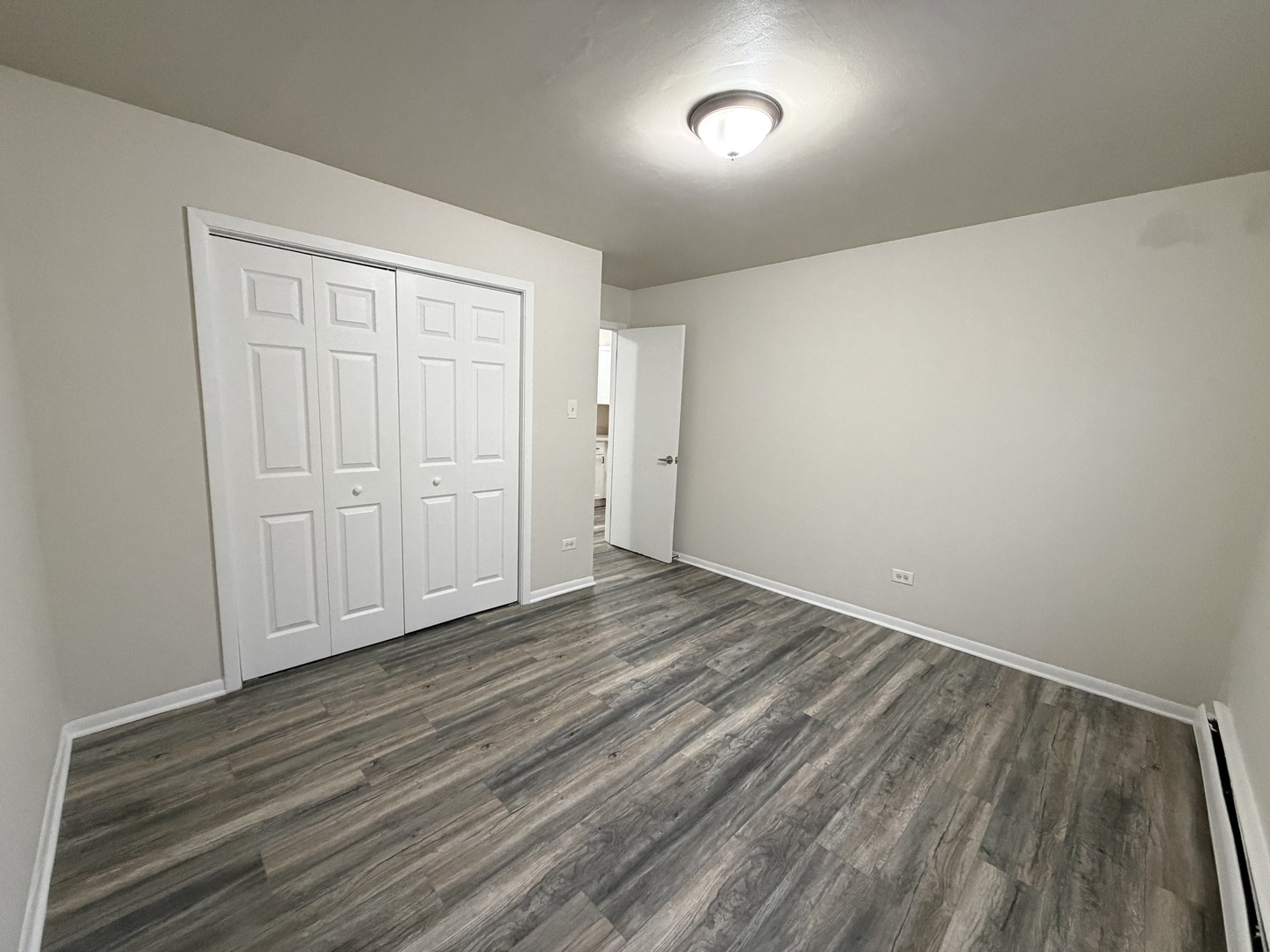 5331 South Kilbourn Avenue, Unit 6 Chicago, IL 60632 - Photo 8 of 11 wooden floor in an empty room