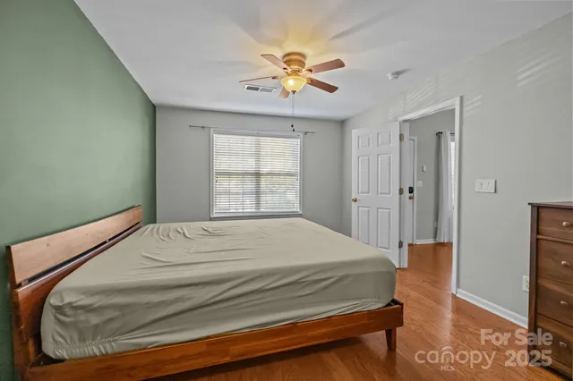 a bathroom with a double vanity sink toilet mirror and shower