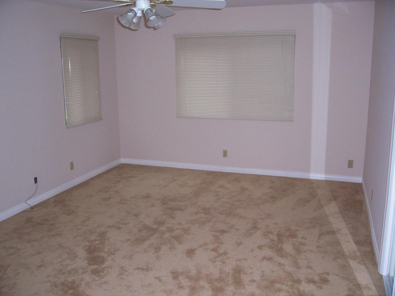 5494 Shemara Street Carpinteria, CA 93013 - Photo 8 of 8 an empty room with a empty space and a ceiling fan