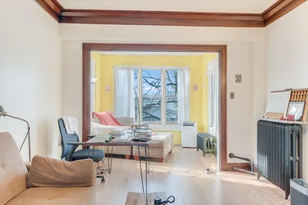 a living room with furniture and a window
