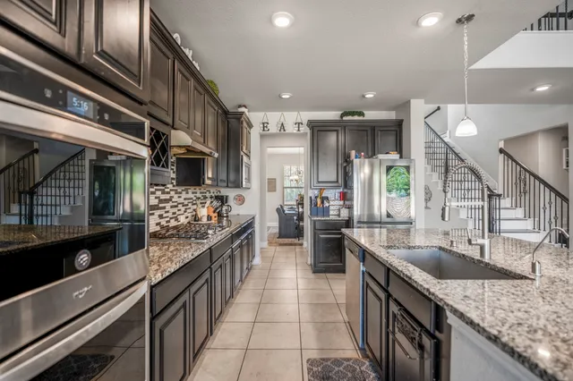 a kitchen with lots of counter space and a sink