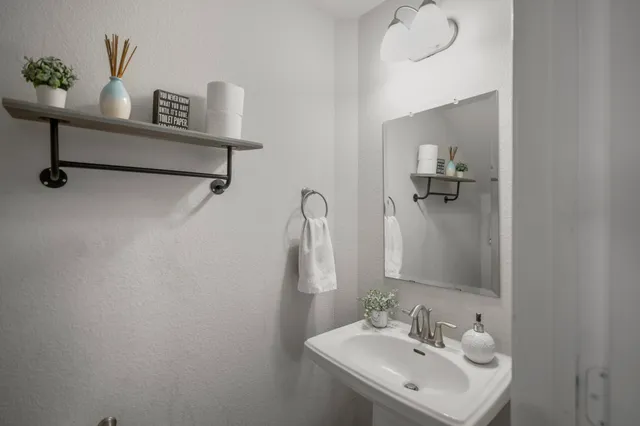 a utility room with dryer washer and wall