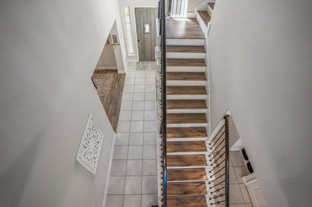 view of a room with wooden floor and windows