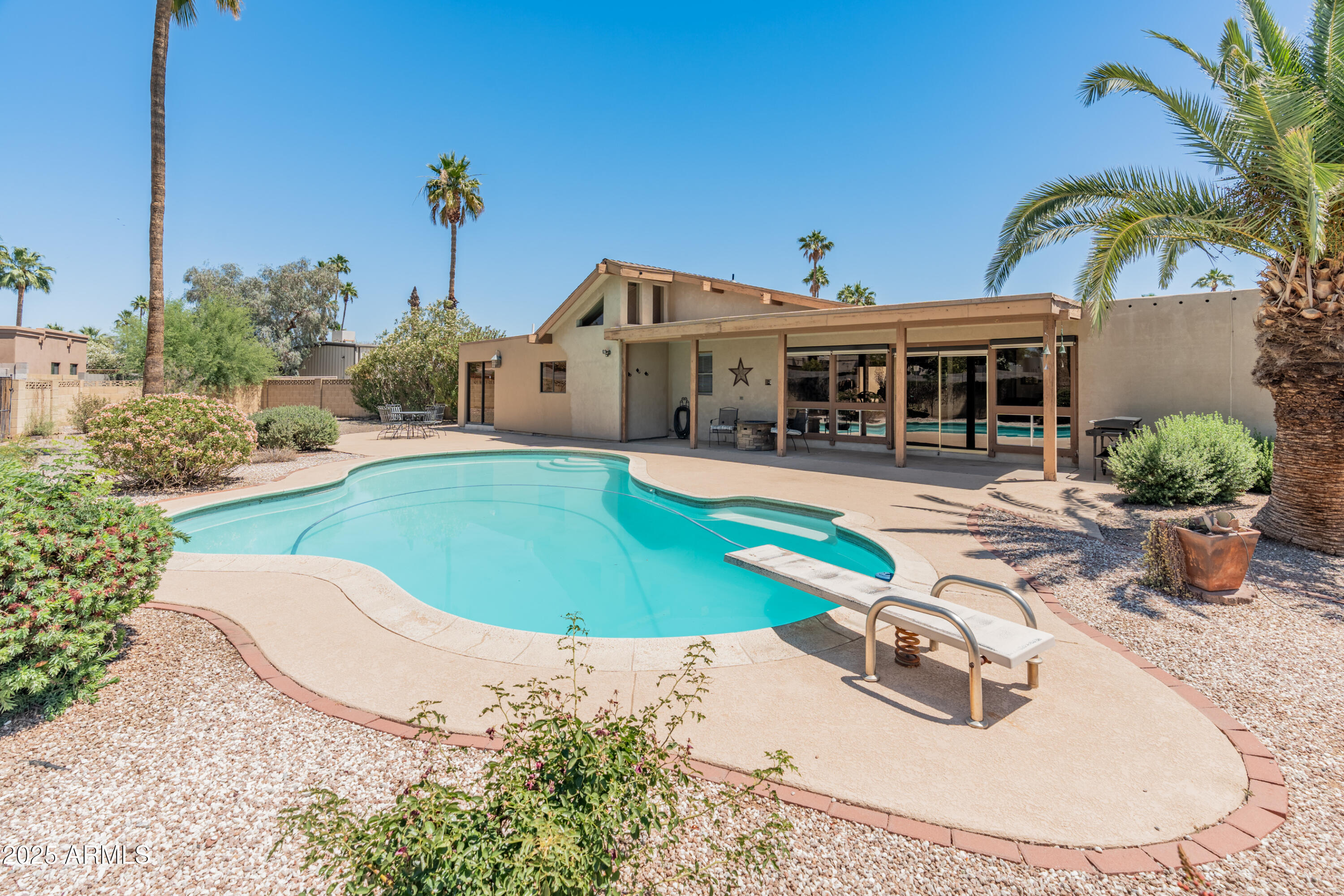 6931 East Pershing Avenue Scottsdale, AZ 85254 - Photo 11 of 59 a view of a house with swimming pool