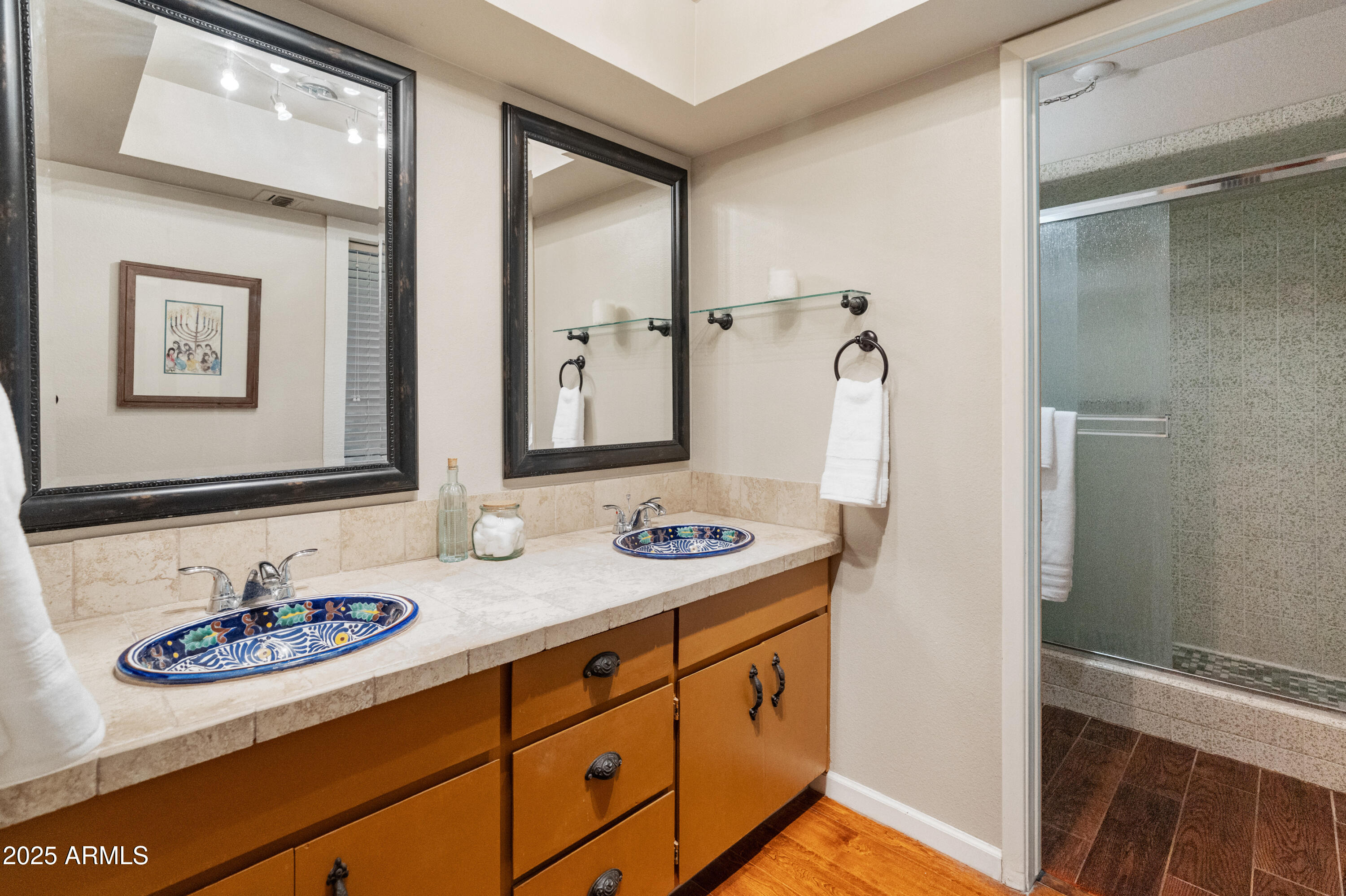 6931 East Pershing Avenue Scottsdale, AZ 85254 - Photo 13 of 59 a bathroom with a sink a vanity and a mirror