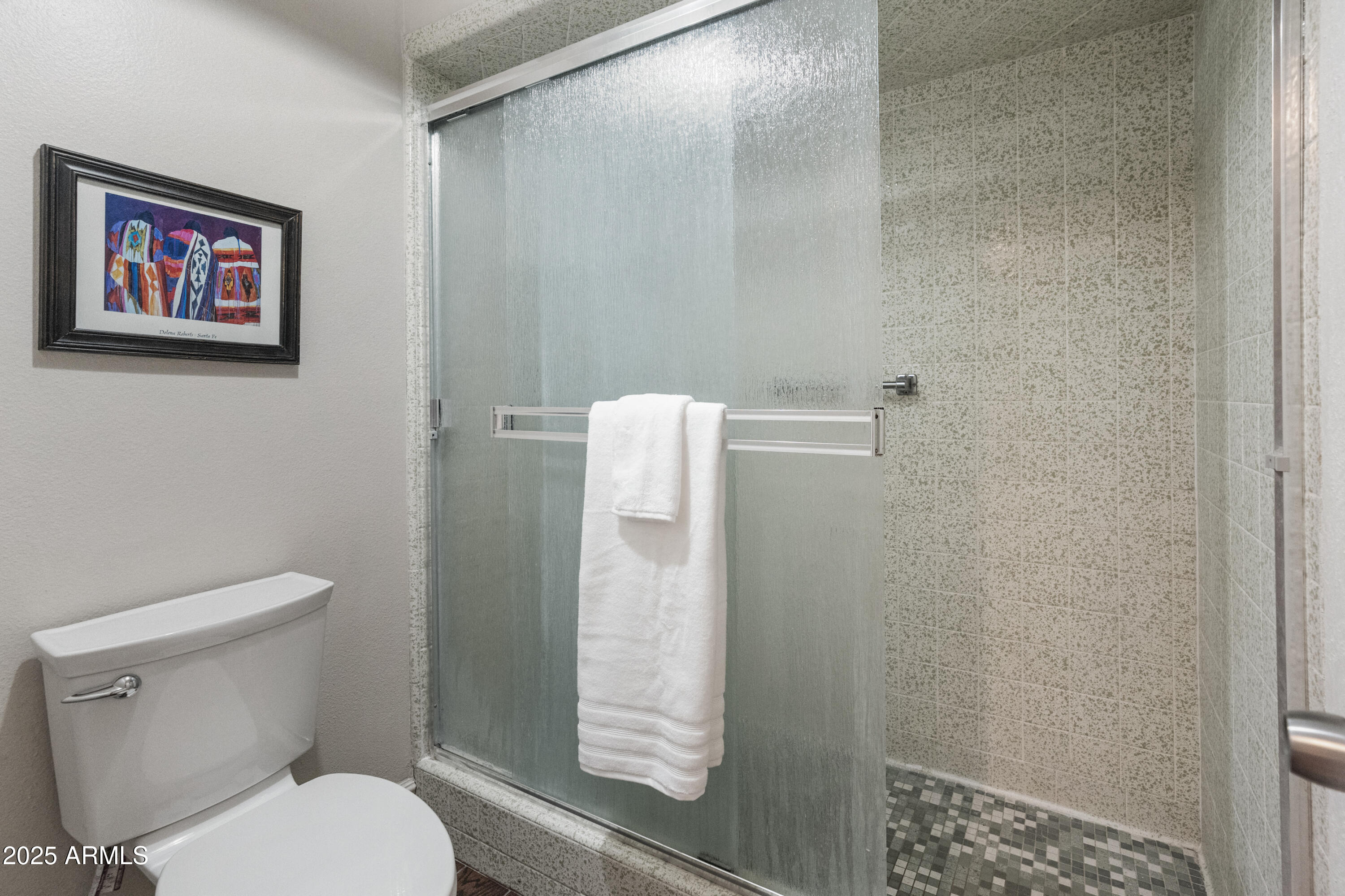 6931 East Pershing Avenue Scottsdale, AZ 85254 - Photo 14 of 59 a white toilet sitting next to a bathroom sink