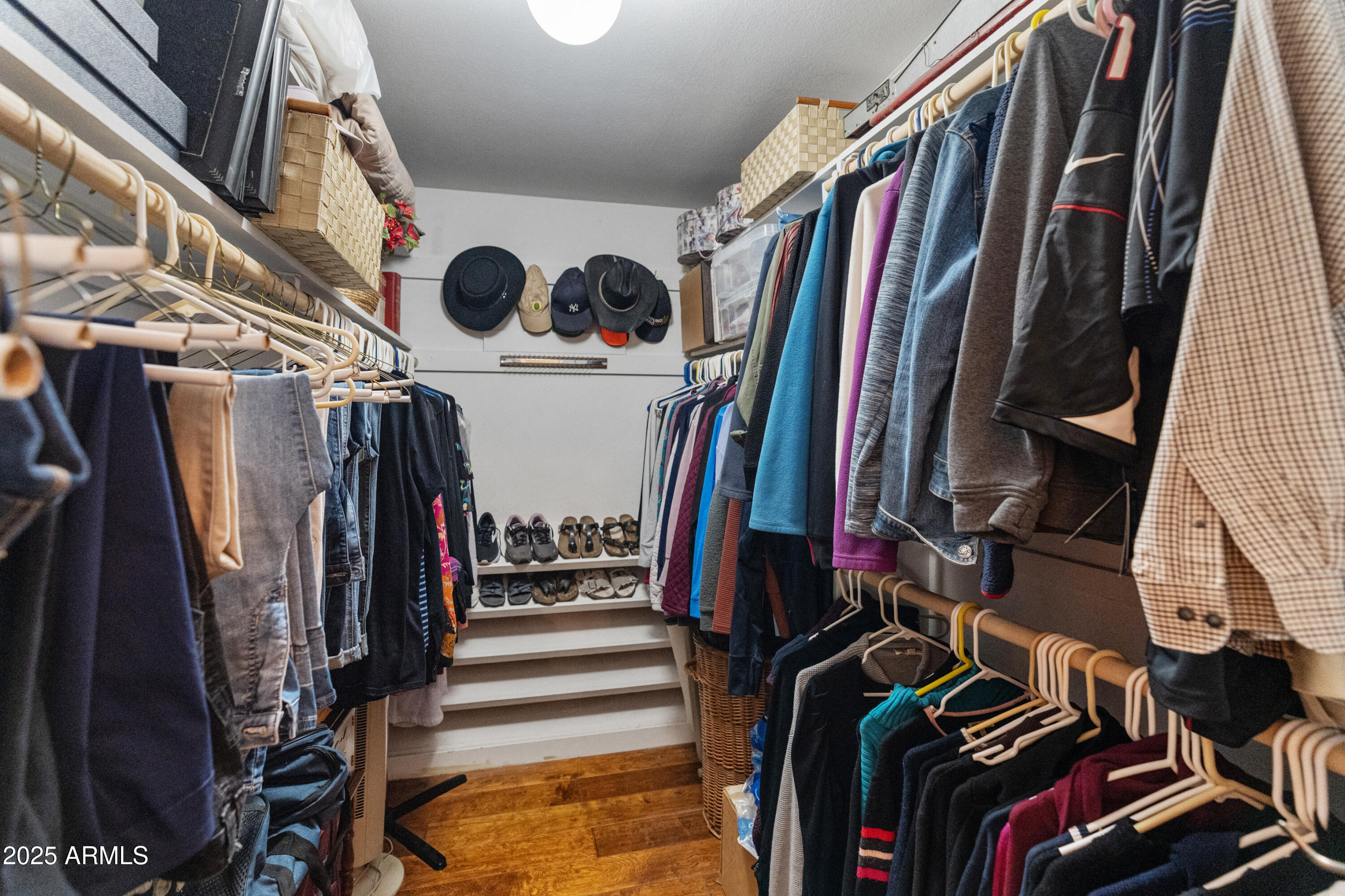 6931 East Pershing Avenue Scottsdale, AZ 85254 - Photo 15 of 59 a view of walk in closet with clothes and shoes