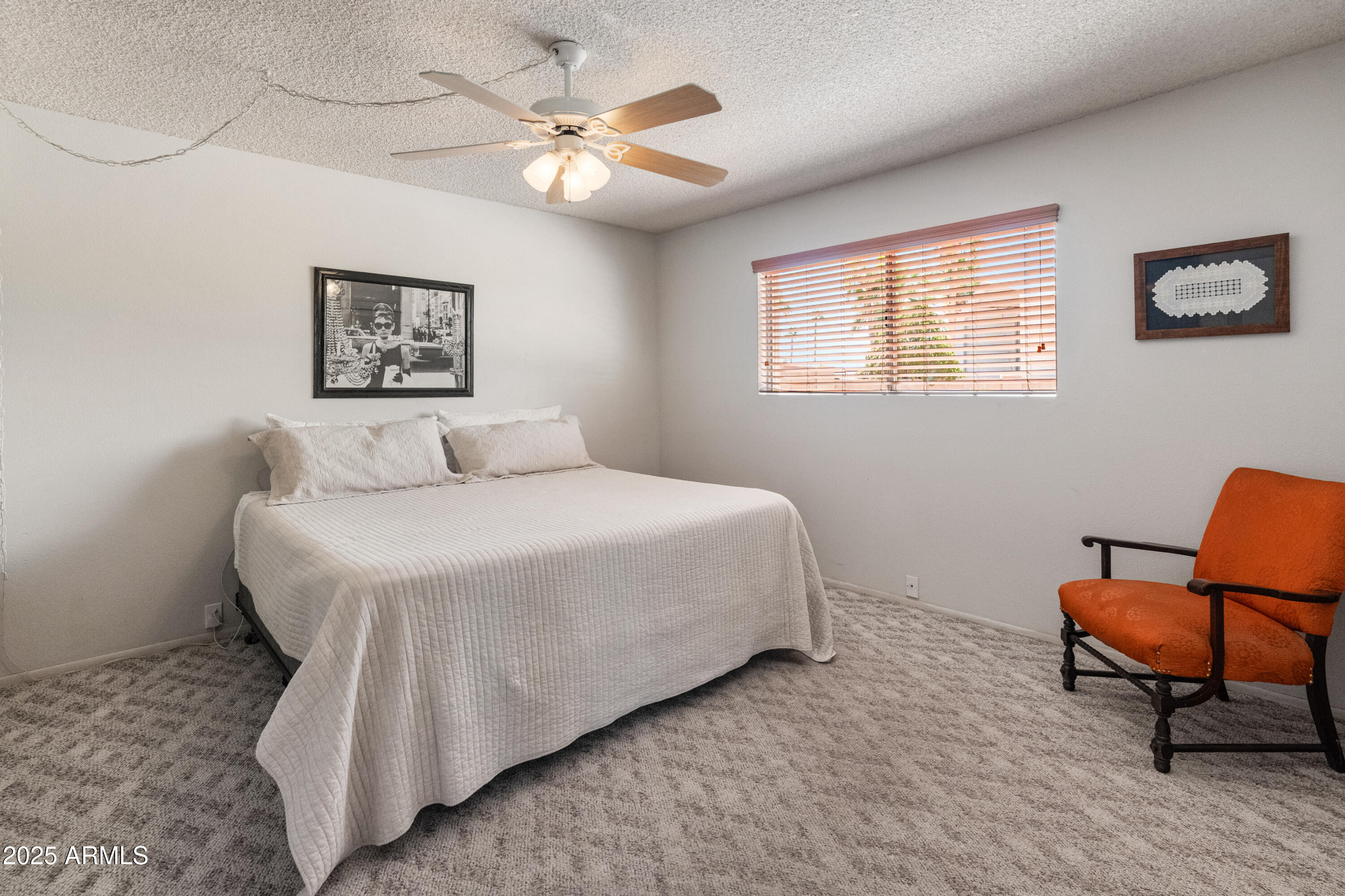 6931 East Pershing Avenue Scottsdale, AZ 85254 - Photo 19 of 59 a bedroom with a bed and chair