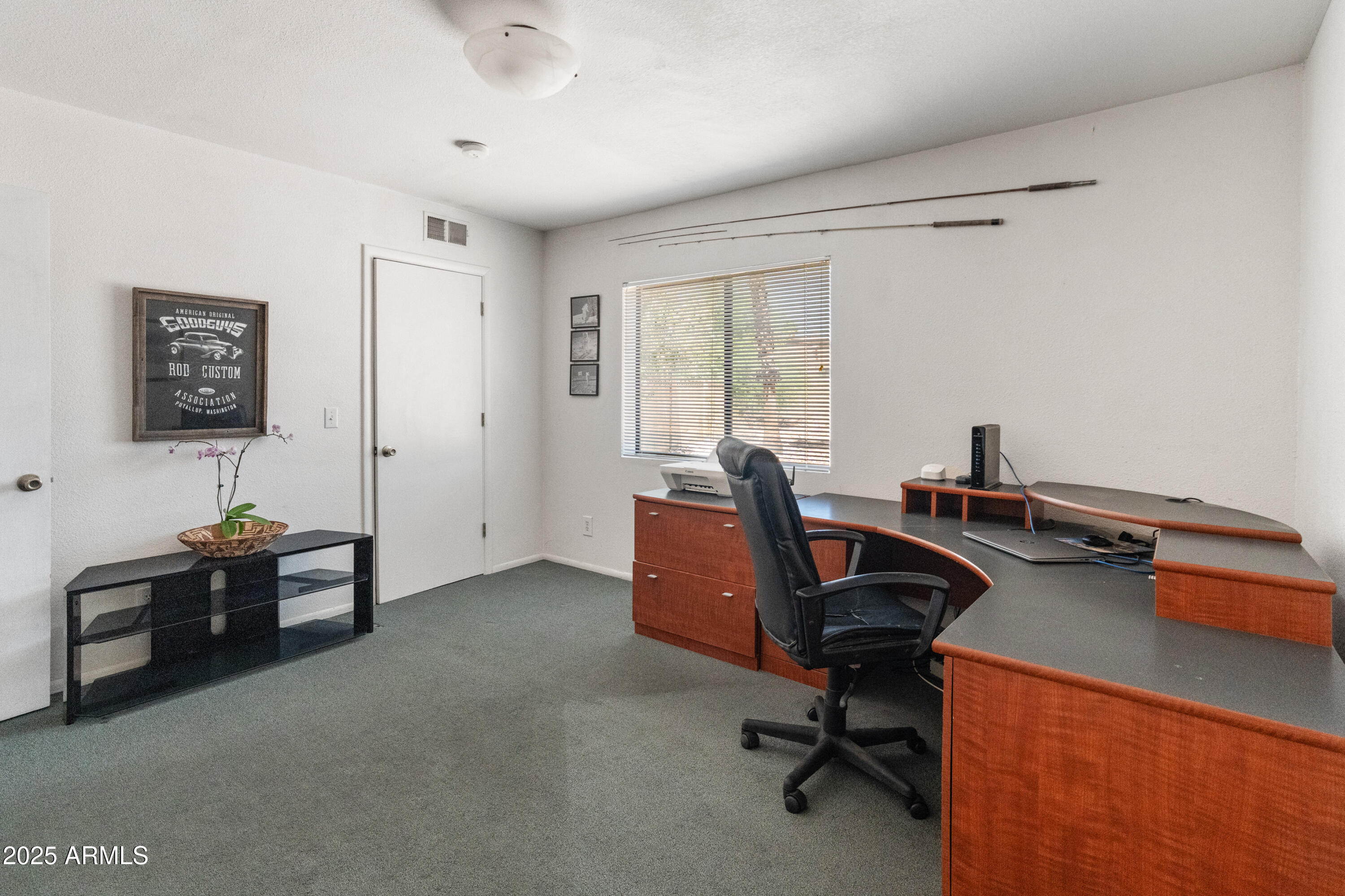 6931 East Pershing Avenue Scottsdale, AZ 85254 - Photo 20 of 59 a view of a workspace with furniture and a window