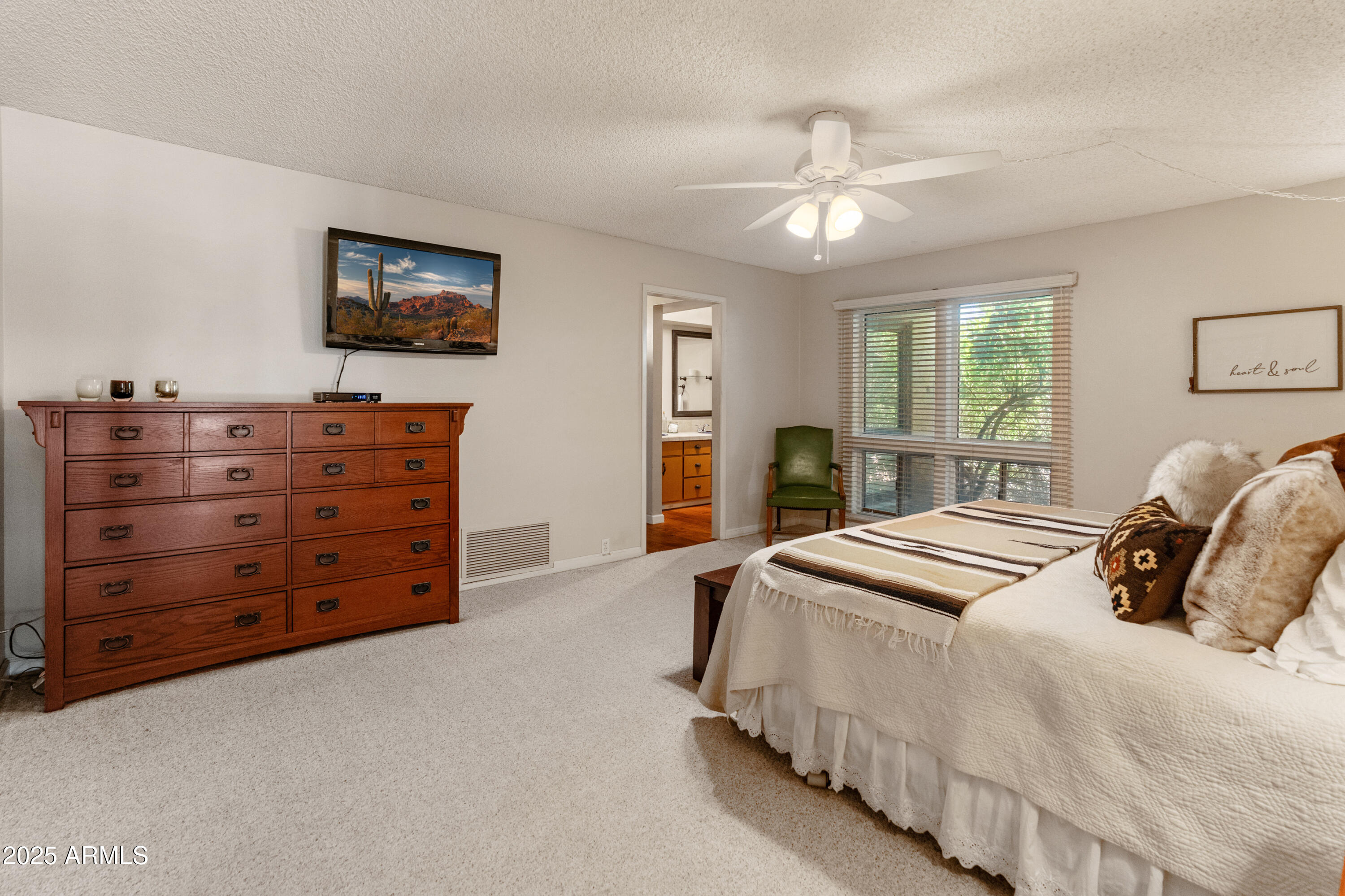 6931 East Pershing Avenue Scottsdale, AZ 85254 - Photo 24 of 59 a bedroom with bed and a chandelier