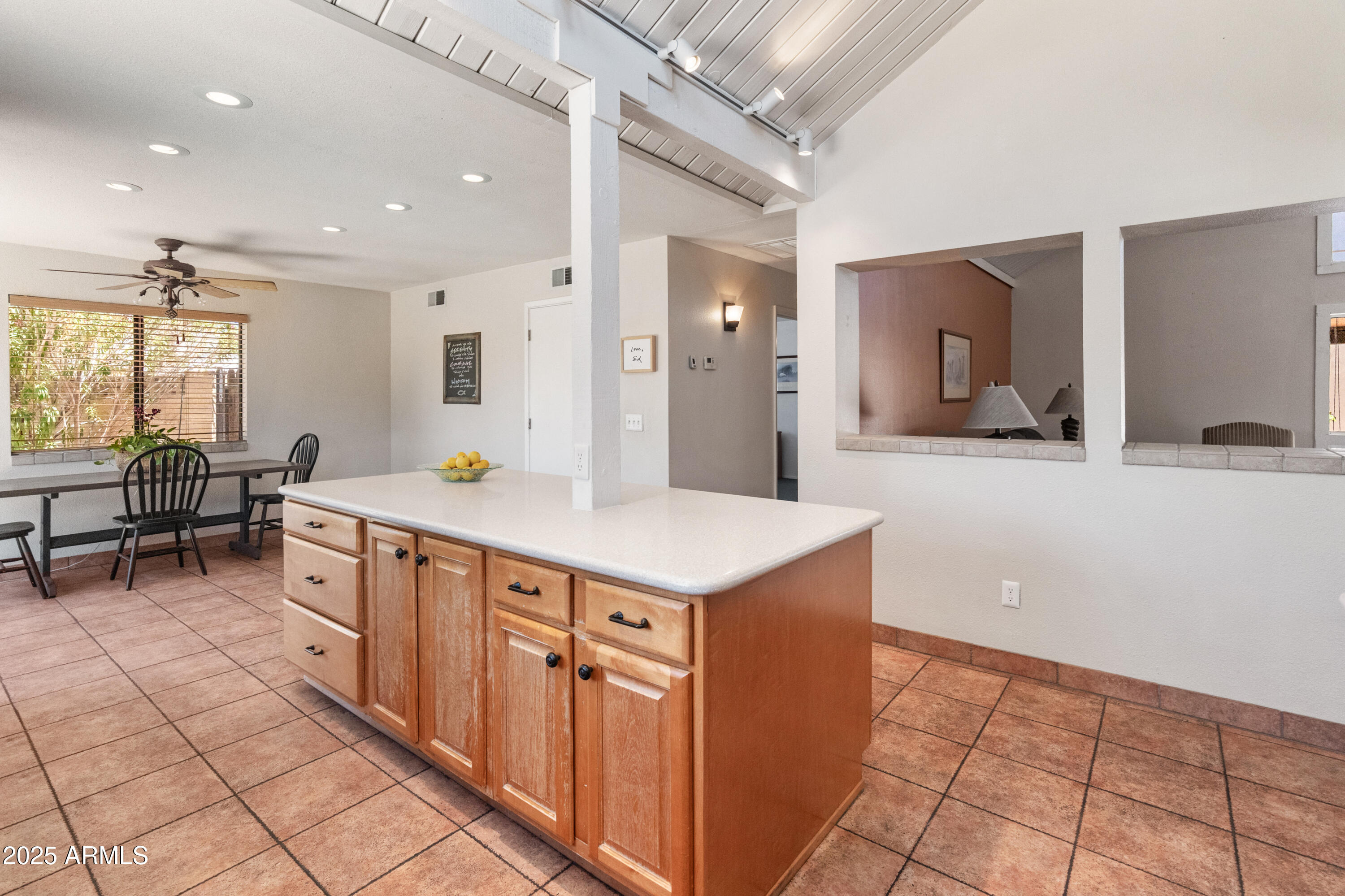 6931 East Pershing Avenue Scottsdale, AZ 85254 - Photo 33 of 59 a spacious kitchen with stainless steel appliances granite countertop a sink and a refrigerator
