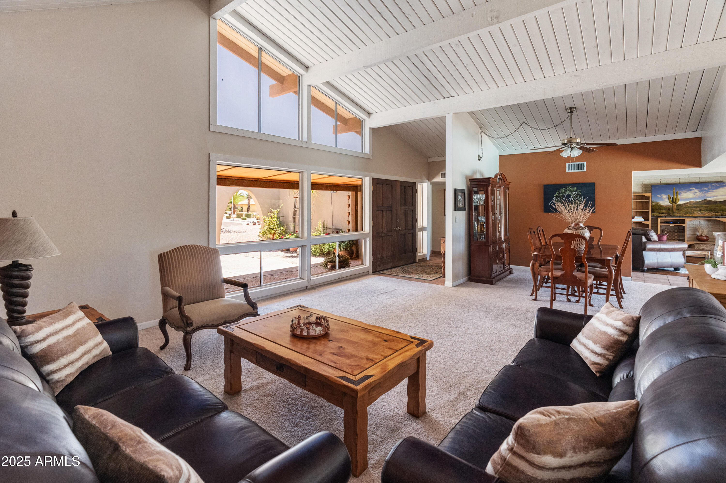 6931 East Pershing Avenue Scottsdale, AZ 85254 - Photo 4 of 59 a living room with furniture and a large window