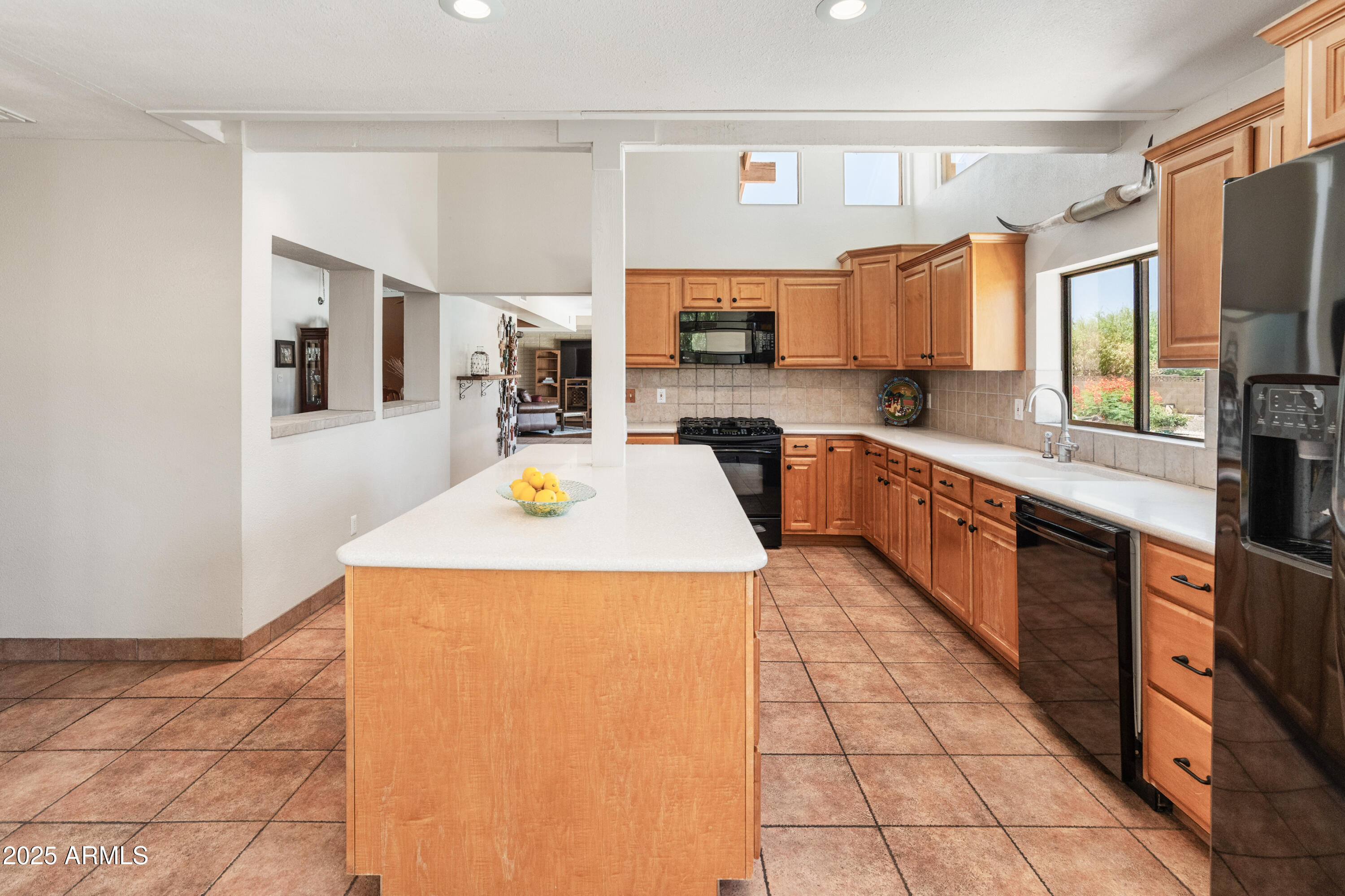 6931 East Pershing Avenue Scottsdale, AZ 85254 - Photo 42 of 59 a large kitchen with a stove a sink dishwasher and a refrigerator