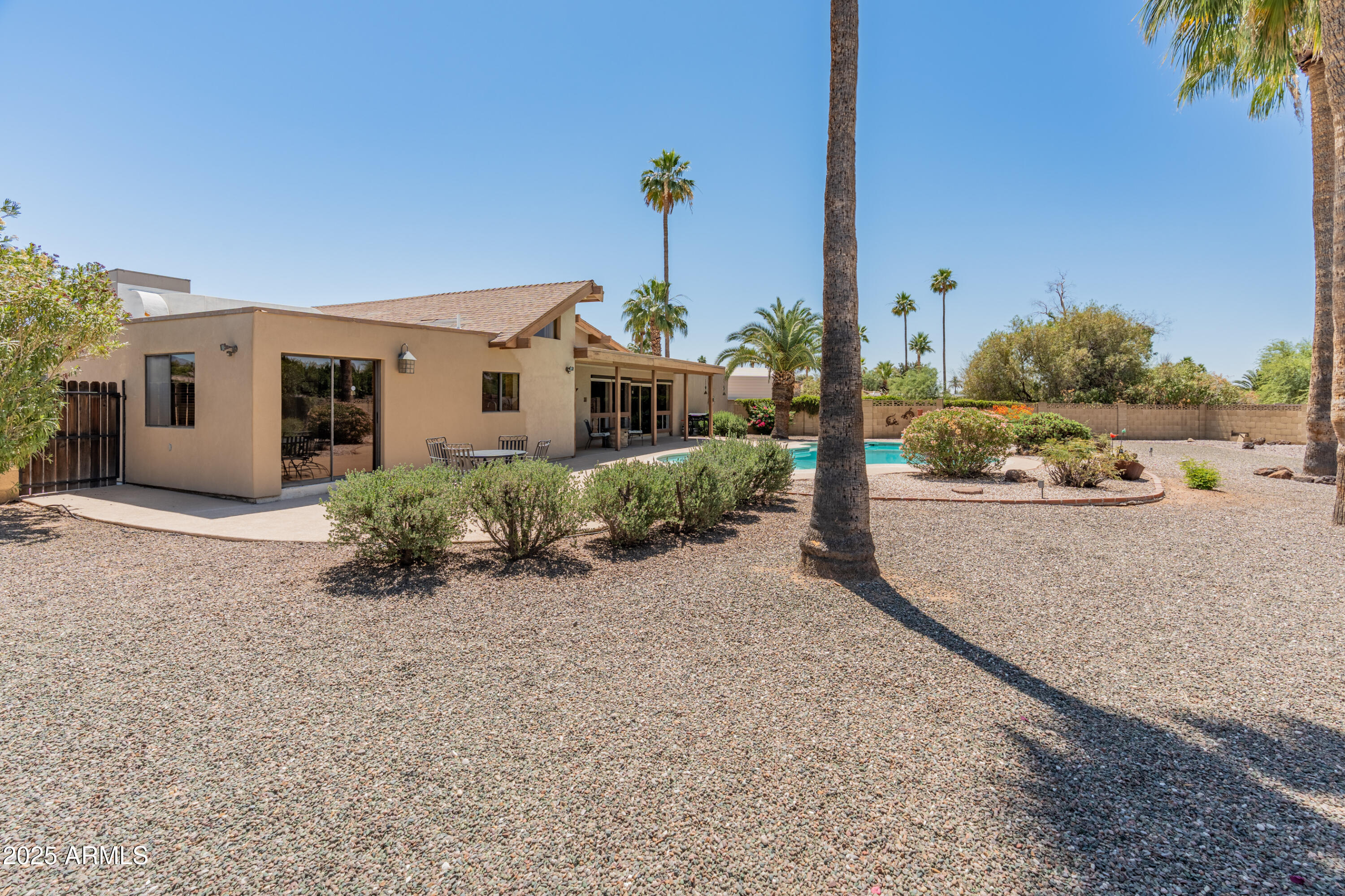 6931 East Pershing Avenue Scottsdale, AZ 85254 - Photo 48 of 59 a view of a house with a yard and plants