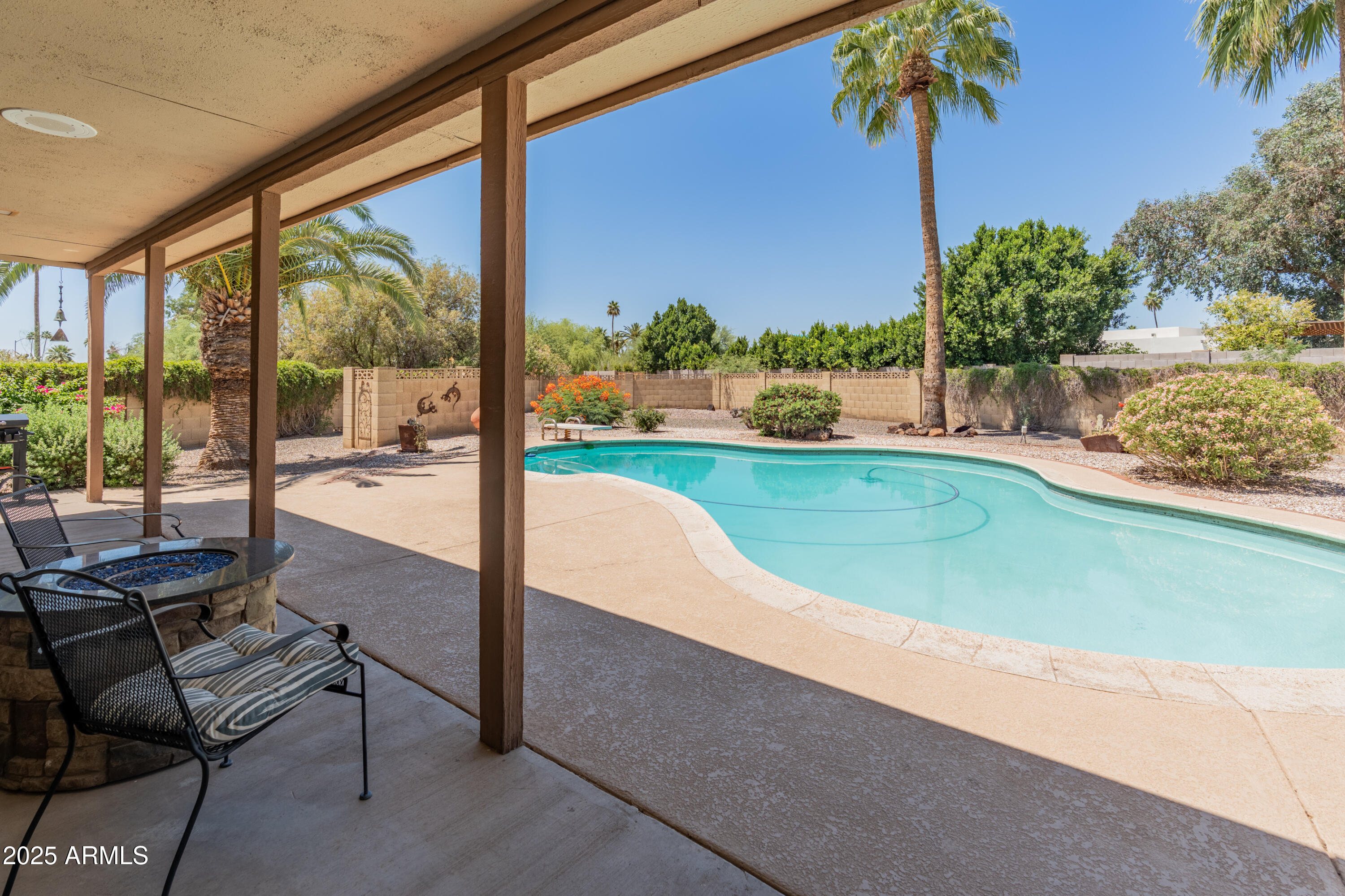 6931 East Pershing Avenue Scottsdale, AZ 85254 - Photo 51 of 59 a view of a swimming pool with a patio