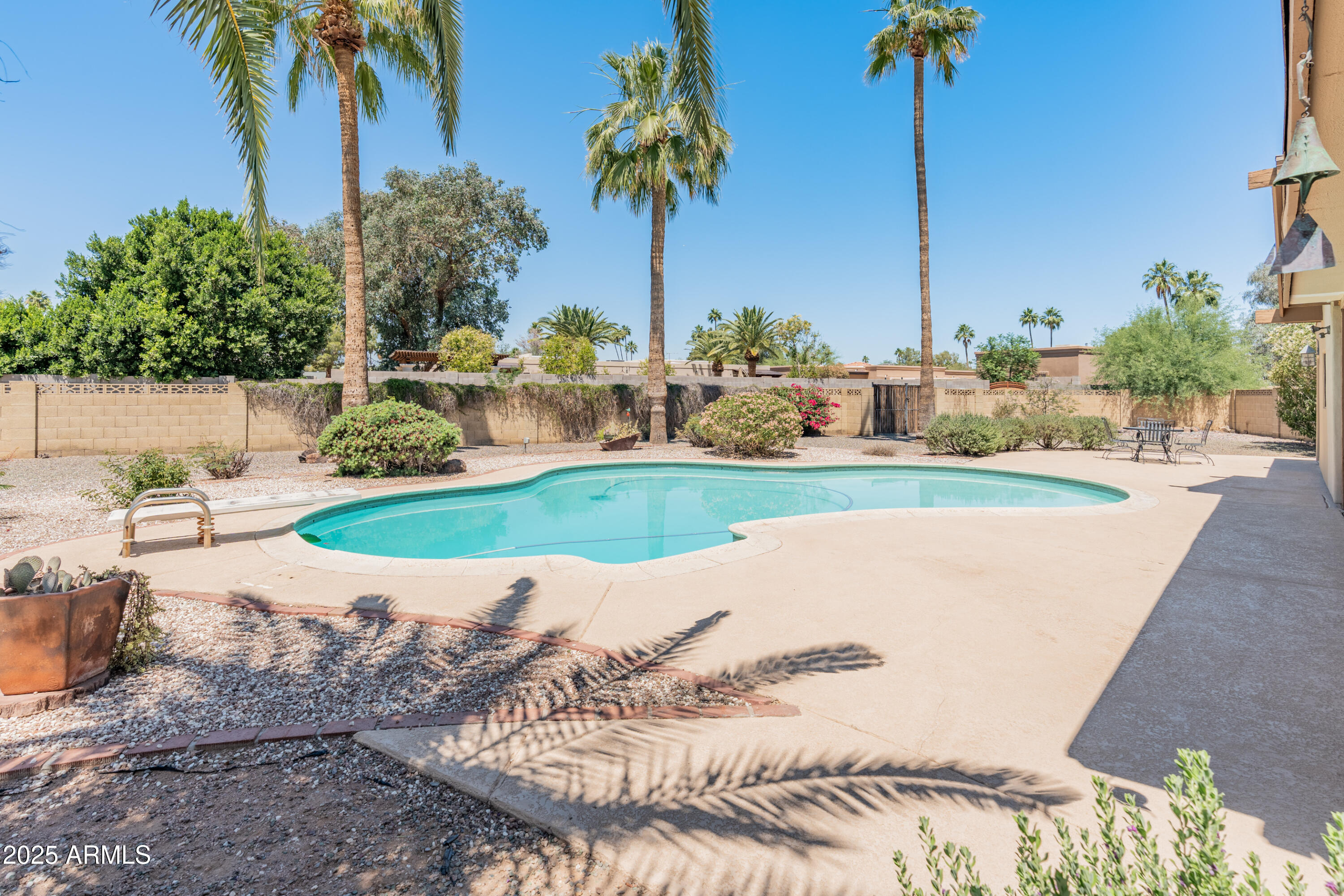 6931 East Pershing Avenue Scottsdale, AZ 85254 - Photo 53 of 59 a view of a backyard with a fountain