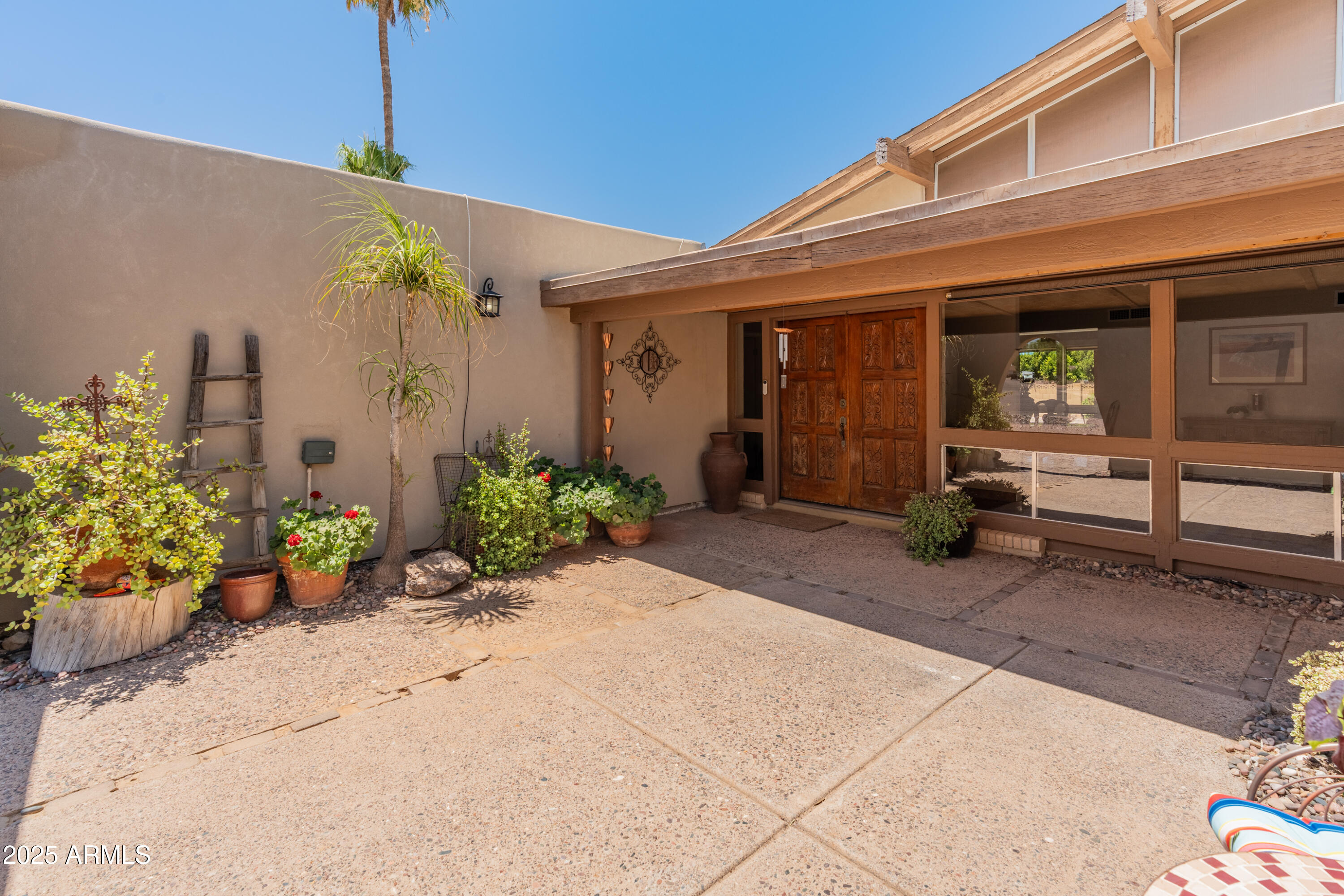 6931 East Pershing Avenue Scottsdale, AZ 85254 - Photo 57 of 59 a front view of a house