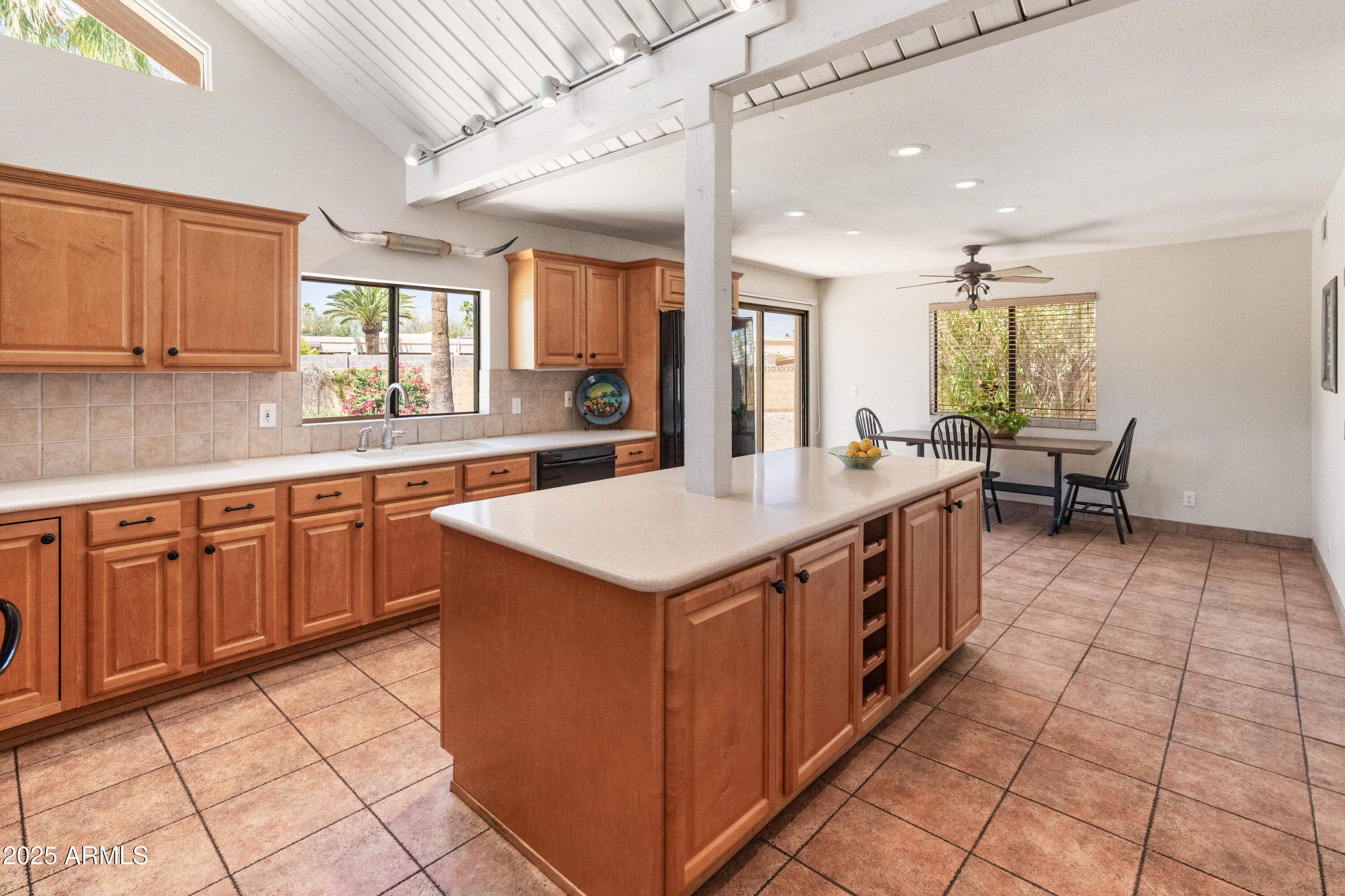 6931 East Pershing Avenue Scottsdale, AZ 85254 - Photo 7 of 59 a kitchen with a sink stove and cabinets