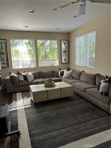 a living room with furniture and windows
